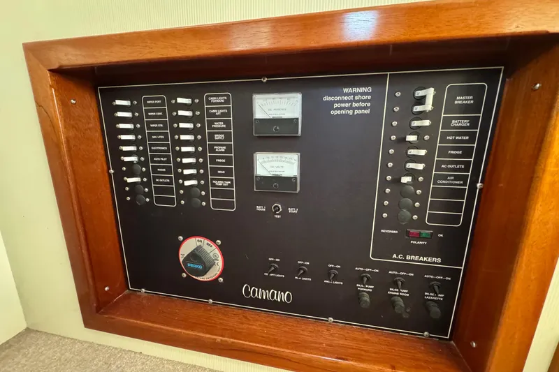 Slide: The Image of 2002 Camano Troller helm with captain's chair, control panel, and large windows. - 31