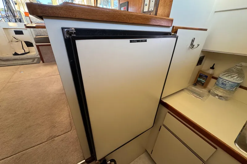 Slide: The Image of Interior of a 2002 Camano Troller yacht with kitchen and bathroom. - 38