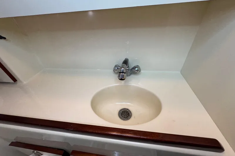 Slide: The Image of Cozy cabin bed in 2002 Camano Troller boat with striped bedding and pillows. - 49