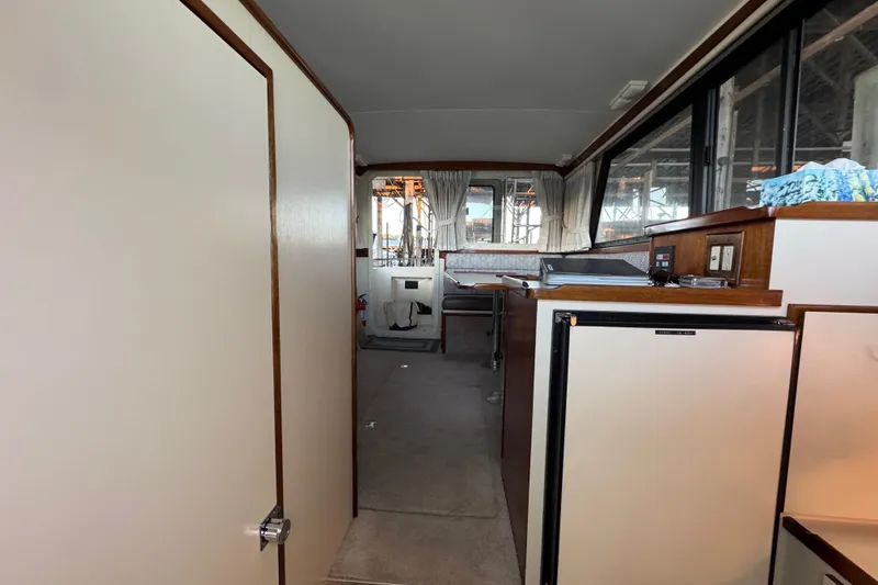 Slide: The Image of 2002 Camano Troller boat sink with chrome faucet and wooden trim. - 52