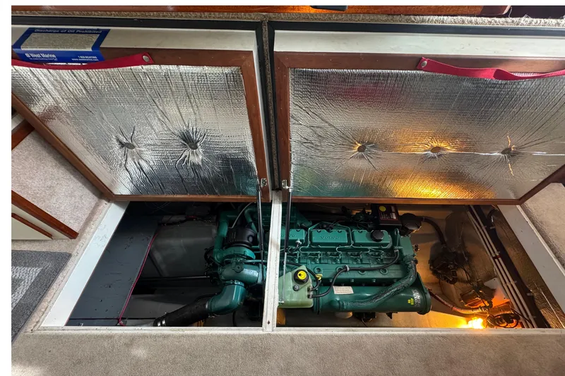 Slide: The Image of Engine compartment of a 2002 Camano Troll 31 boat with insulation panels. - 64