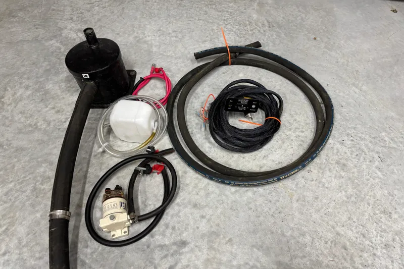 Slide: The Image of Assorted marine parts for 2002 Camano Troll 31, including hoses and electrical components. - 70