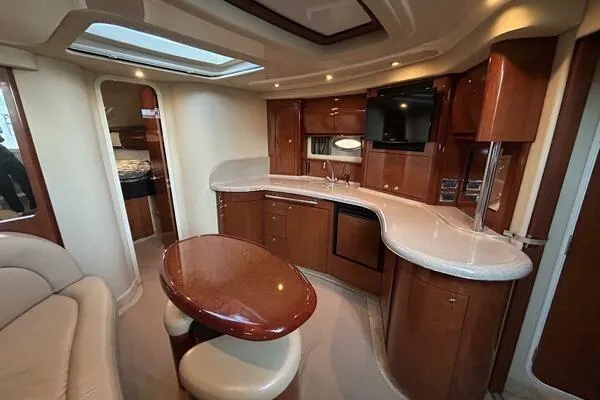 Slide: The Image of Luxurious interior of 2003 Sea Ray 420 Sundancer yacht with elegant wood finishes. - 10