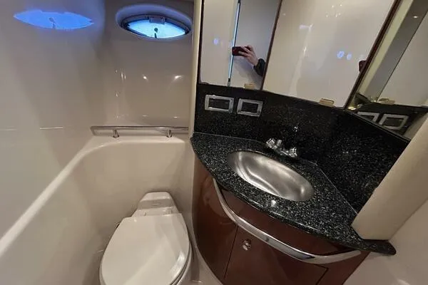 Slide: The Image of Bathroom interior of 2003 Sea Ray 420 Sundancer yacht with sink and toilet. - 11