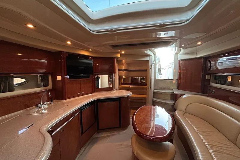 Slide: The Image of Luxurious interior of a 2003 Sea Ray 420 Sundancer yacht with elegant wood finishes. - 5