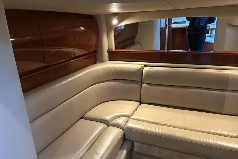 Slide: The Image of Luxurious interior of 2003 Sea Ray 420 Sundancer yacht with beige leather seating. - 6