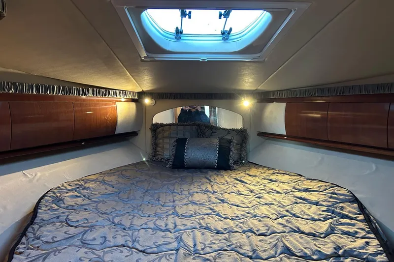 Slide: The Image of Luxurious cabin interior of 2003 Sea Ray 420 Sundancer yacht with elegant bedding. - 7