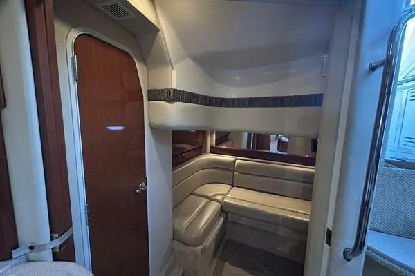 Slide: The Image of Interior of 2003 Sea Ray 420 Sundancer yacht with cozy seating area. - 8