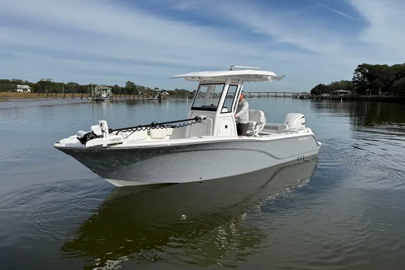Slide: The Image of 2025 Sea Fox 248 Commander boat on calm water, featuring sleek design and modern amenities. - 1