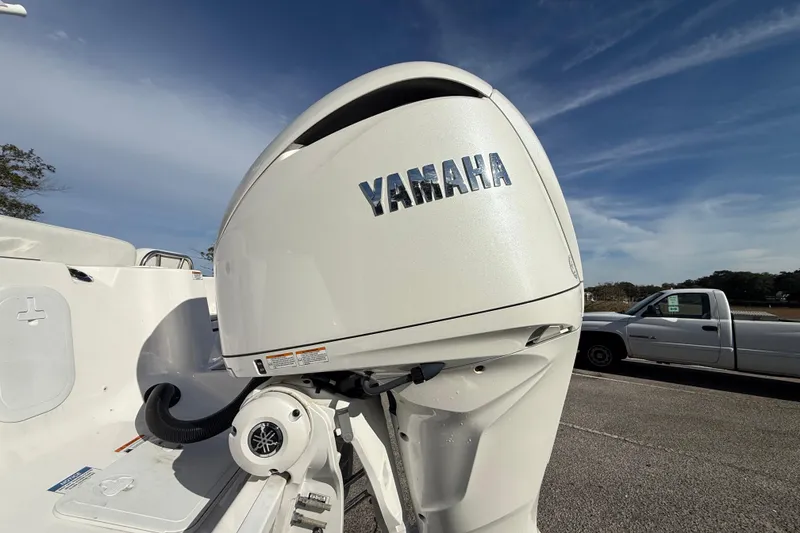 Slide: The Image of 2025 Sea Fox 248 Commander with Yamaha outboard motor, parked outdoors. - 10