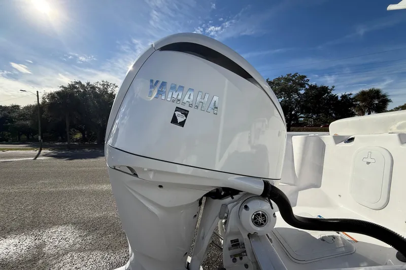 Slide: The Image of Yamaha outboard motor on 2025 Sea Fox 248 Commander boat under clear sky. - 11