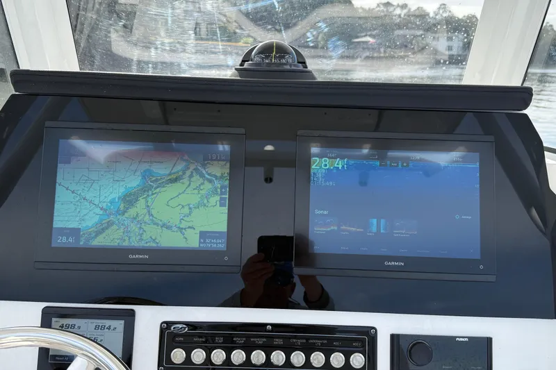 Slide: The Image of Dashboard of 2025 Sea Fox 248 Commander with dual Garmin displays and navigation controls. - 13