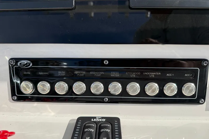 Slide: The Image of Control panel of 2025 Sea Fox 248 Commander boat with labeled switches. - 18