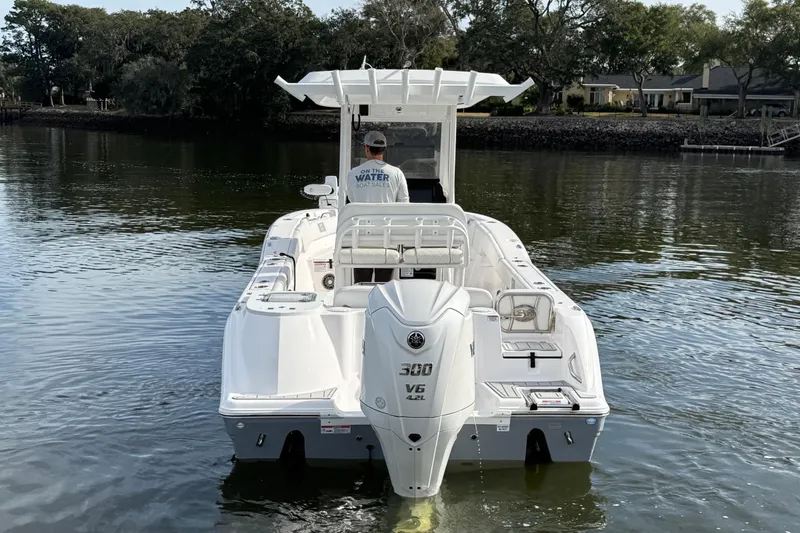 Slide: The Image of 2025 Sea Fox 248 Commander boat on calm water, rear view. - 4