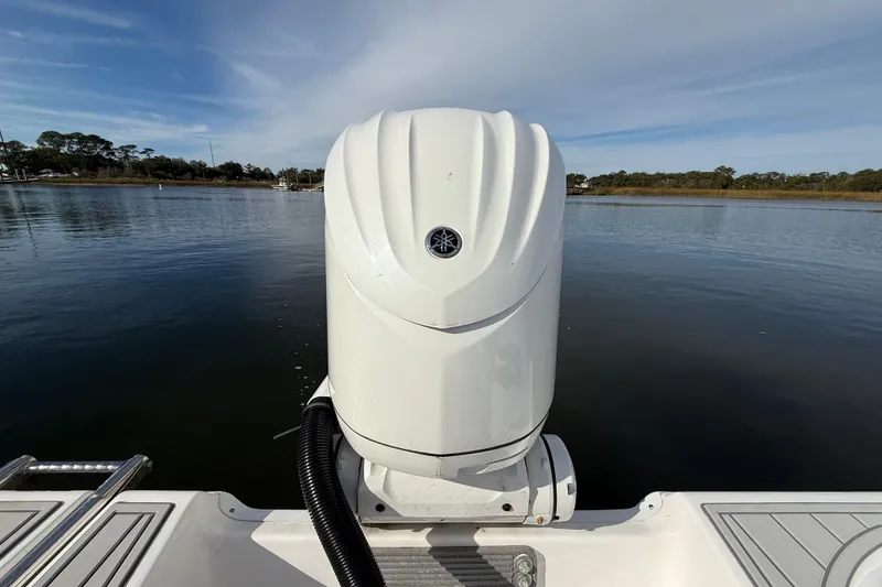 Slide: The Image of 2025 Sea Fox 248 Commander boat with Yamaha outboard motor on calm water. - 9