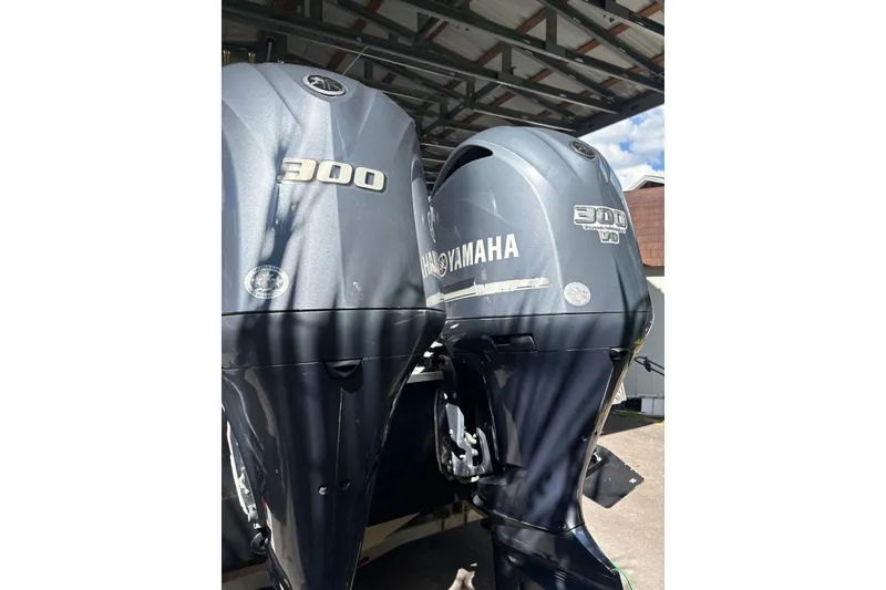 Slide: The Image of Twin Yamaha 300 outboard engines on a 2012 Wellcraft 30 Scarab Offshore Sport boat. - 10