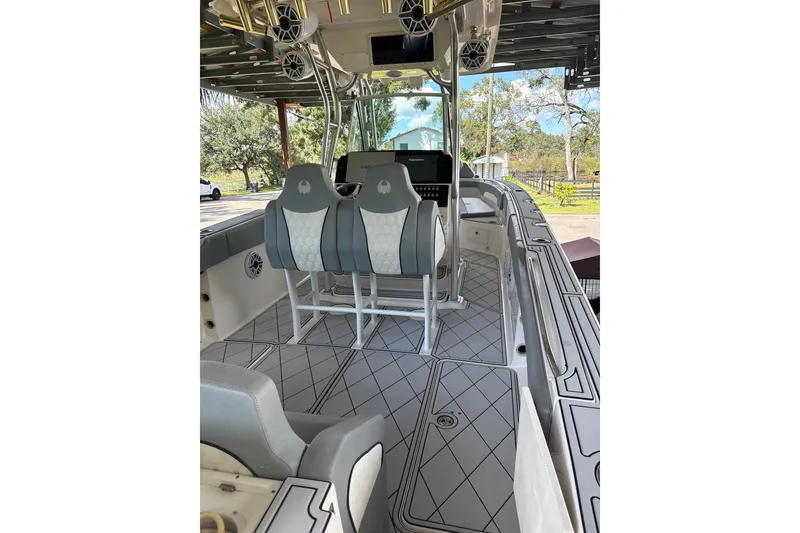 Slide: The Image of 2012 Wellcraft 30 Scarab Offshore Sport boat interior with modern seating and controls. - 8