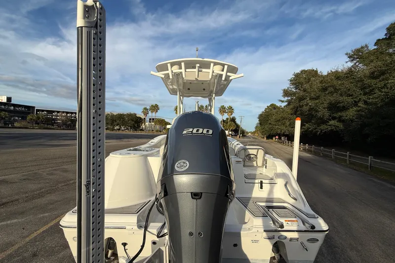 Slide: The Image of 2021 Sea Fox 228 Commander boat with powerful 200 engine, parked on a sunny day. - 10