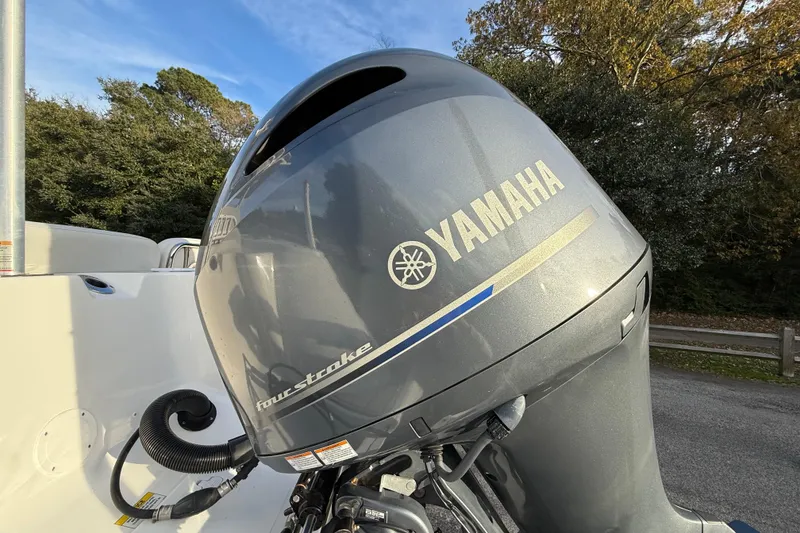 Slide: The Image of Yamaha four-stroke engine on 2021 Sea Fox 228 Commander boat, outdoor setting. - 11