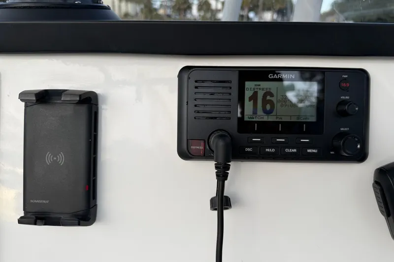 Slide: The Image of Garmin marine radio and phone holder on 2021 Sea Fox 228 Commander boat dashboard. - 15