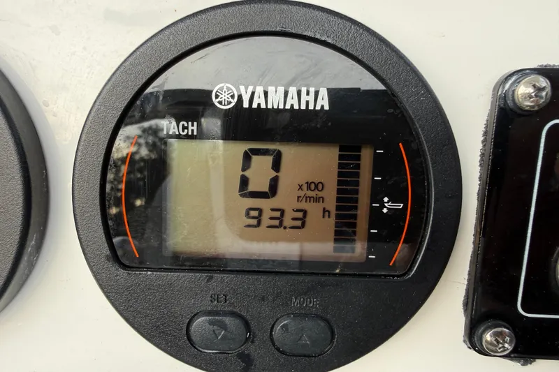 Slide: The Image of Yamaha tachometer displaying 93.3 hours on a 2021 Sea Fox 228 Commander boat. - 17