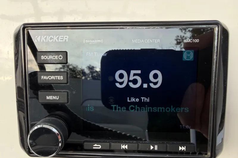 Slide: The Image of Kicker media center in 2021 Sea Fox 228 Commander displaying FM station 95.9. - 18