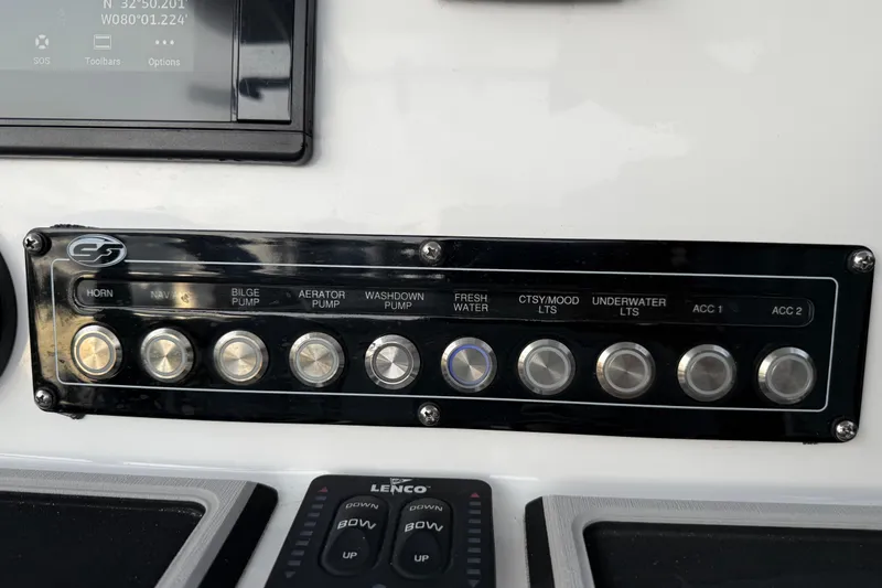 Slide: The Image of Control panel of a 2021 Sea Fox 228 Commander boat with various switches. - 20