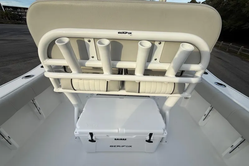 Slide: The Image of 2021 Sea Fox 228 Commander boat interior with rod holders and Yeti cooler. - 23