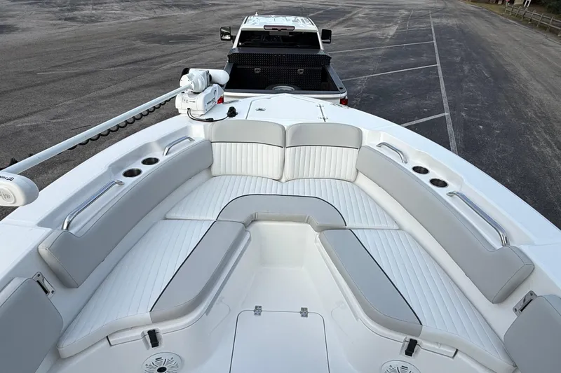 Slide: The Image of 2021 Sea Fox 228 Commander boat interior with white seating and cup holders. - 24