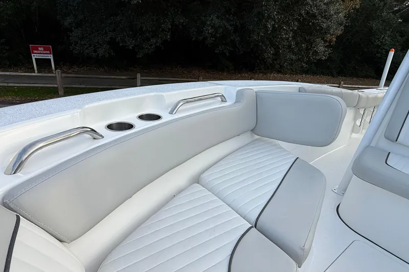 Slide: The Image of 2021 Sea Fox 228 Commander boat interior with cushioned seating and cup holders. - 25