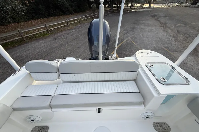 Slide: The Image of 2021 Sea Fox 228 Commander boat interior with seating and engine view. - 28