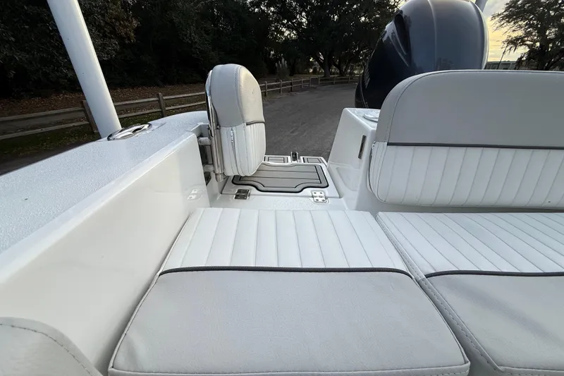 Slide: The Image of 2021 Sea Fox 228 Commander boat interior with white cushioned seating and sleek design. - 29