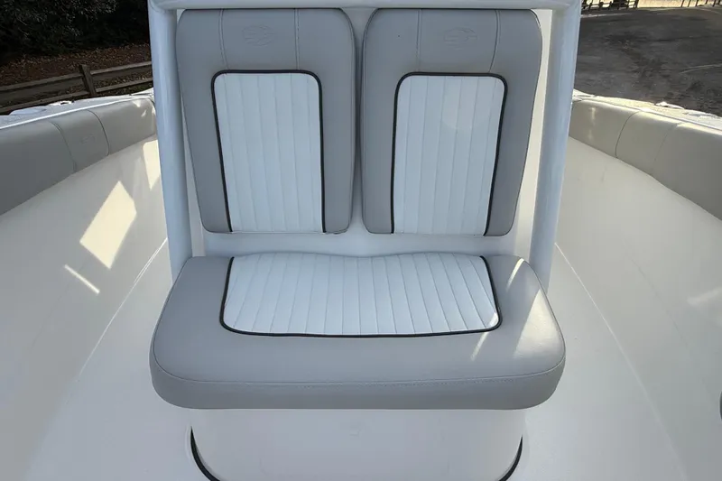 Slide: The Image of 2021 Sea Fox 228 Commander boat seat with white and gray upholstery. - 31