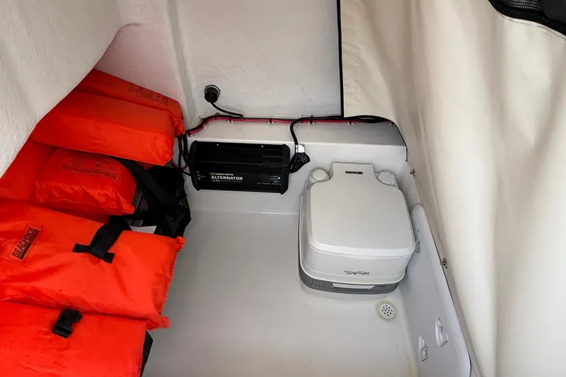 Slide: The Image of Interior of 2021 Sea Fox 228 Commander with life jackets and portable toilet. - 35