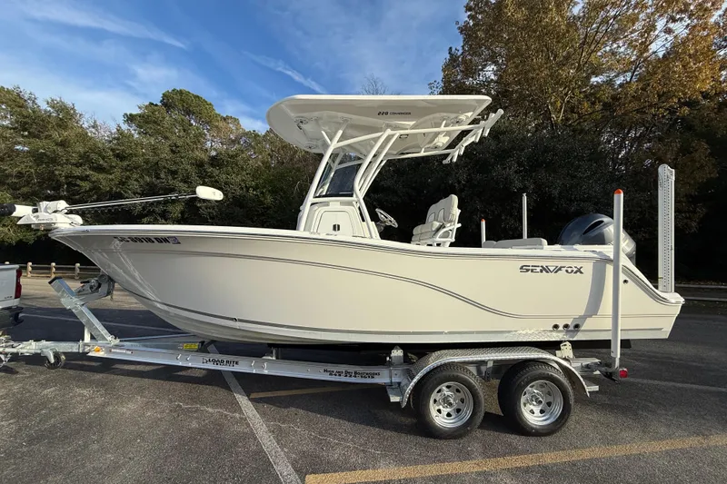 Slide: The Image of 2021 Sea Fox 228 Commander boat on trailer, parked outdoors. - 7