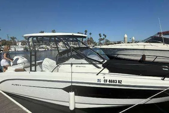 Slide: The Image of 2024 Beneteau Oceanis 281 docked at marina under clear blue sky. - 12