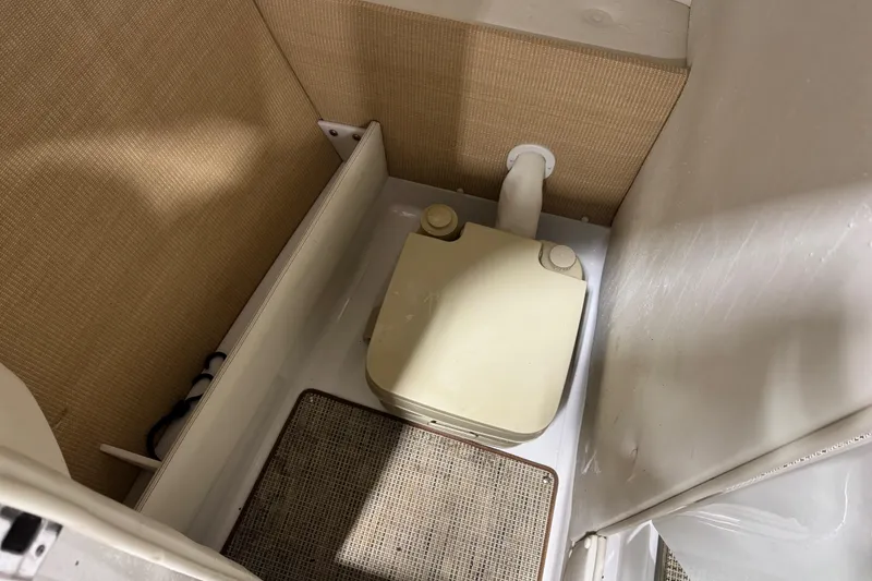 Slide: The Image of Compact bathroom area in a 2015 Cobalt R5 boat. - 10