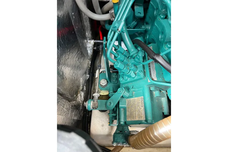 Slide: The Image of Engine compartment of a 2007 Delphia 33 Sloop, showcasing mechanical components. - 102