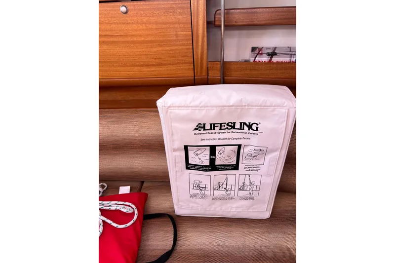 Slide: The Image of Lifesling rescue system on 2007 Delphia 33 Sloop, featuring safety instructions. - 112