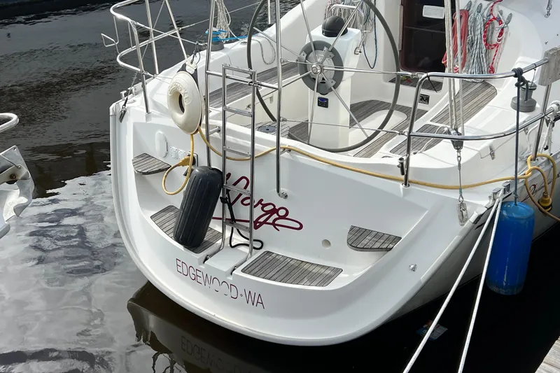 Slide: The Image of 2007 Delphia 33 Sloop sailboat docked, featuring a sleek design and modern fittings. - 15