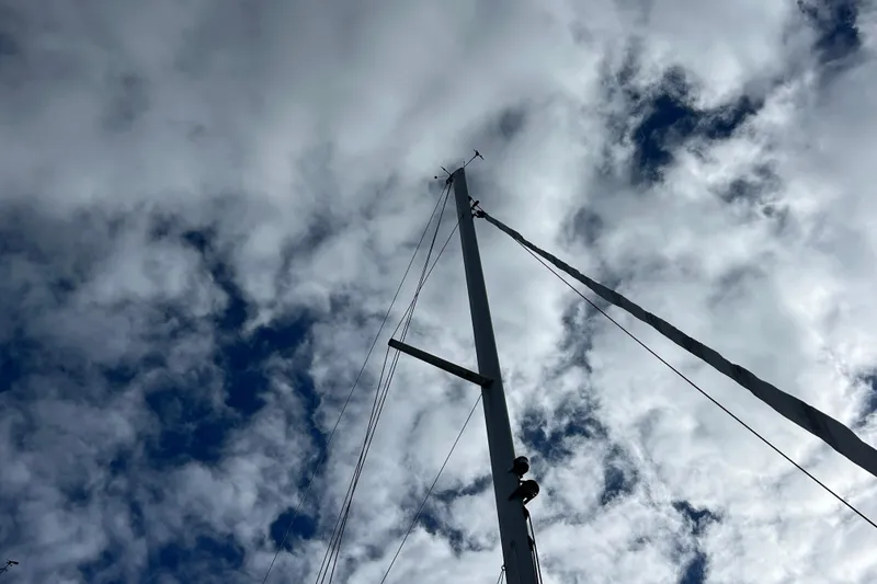 Slide: The Image of Mast of 2007 Delphia 33 Sloop against a cloudy sky. - 19