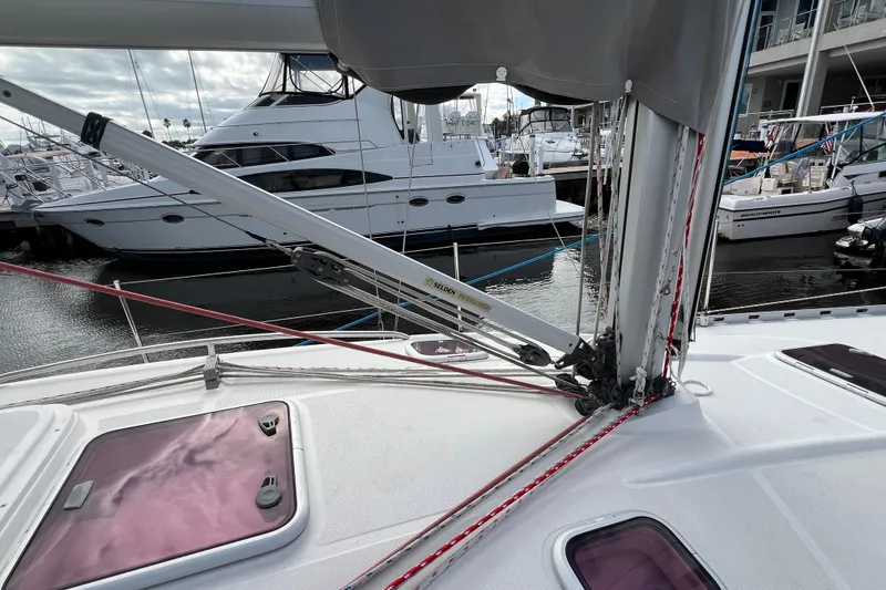 Slide: The Image of Delphia 33 Sloop 2007 sailboat deck with rigging and marina view. - 23
