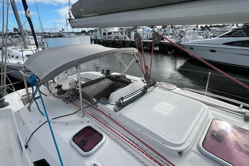 Slide: The Image of 2007 Delphia 33 Sloop sailboat docked at marina, featuring deck and rigging. - 25