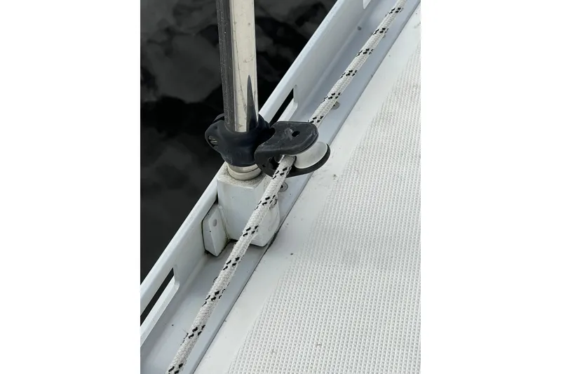 Slide: The Image of Close-up of a 2007 Delphia 33 Sloop deck with rigging and pulley system. - 43