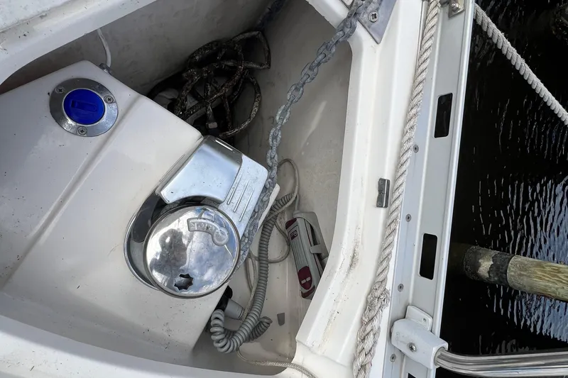 Slide: The Image of Anchor chain and winch on 2007 Delphia 33 Sloop sailboat deck. - 47