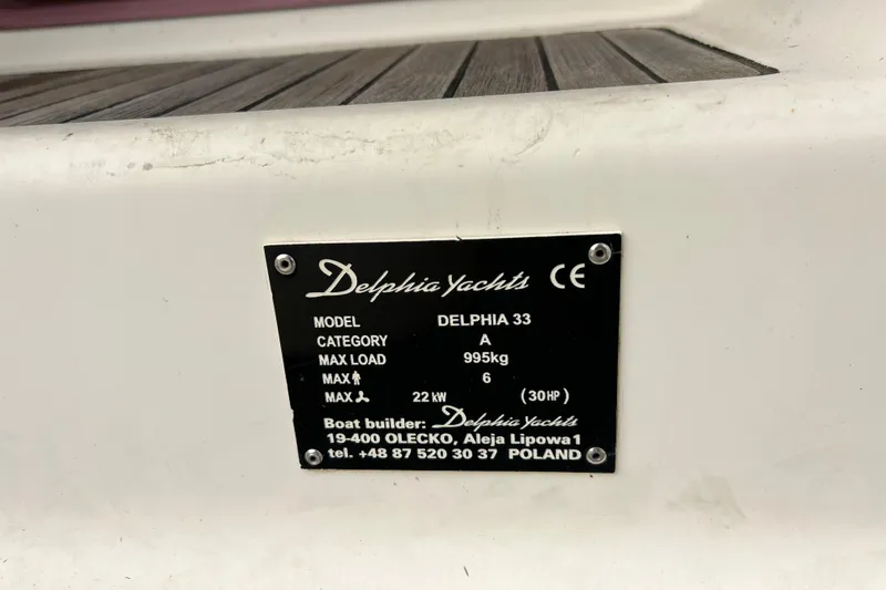 Slide: The Image of Plaque on 2007 Delphia 33 Sloop, displaying model details and specifications. - 60