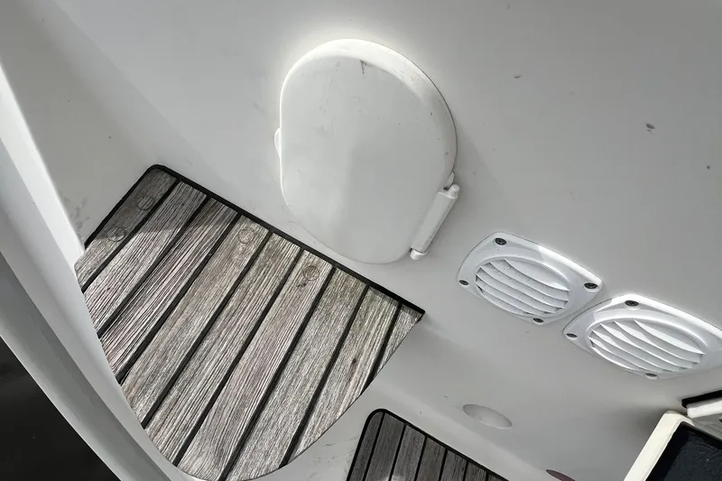 Slide: The Image of Delphia 33 Sloop 2007 deck with wooden flooring and ventilation grilles. - 65