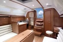 Slide: The Image of Interior of 2007 Delphia 33 Sloop, featuring elegant wood finishes and comfortable seating. - 71