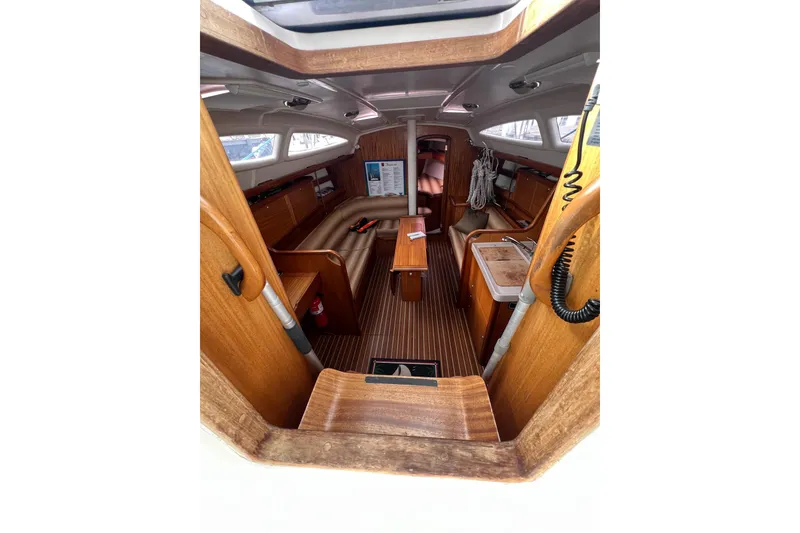 Slide: The Image of Interior of 2007 Delphia 33 Sloop, featuring wooden finishes and compact layout. - 72