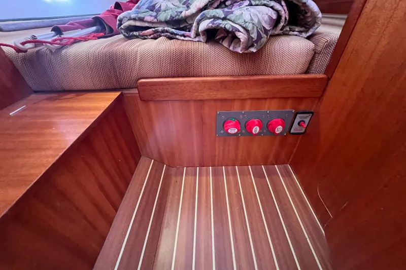 Slide: The Image of Interior of 2007 Delphia 33 Sloop with wooden flooring and control panel. - 81
